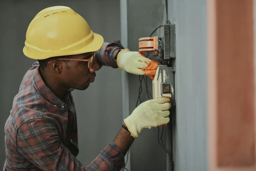 Professional appliance technician working on circuitry in Dollard-des-Ormeaux